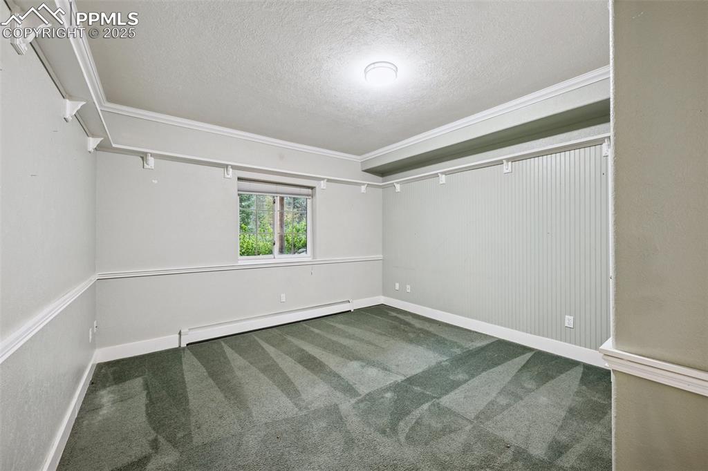17522 Abert Ridge View Colorado Springs, CO 80908 - Photo 41 of 46 an empty room with a window