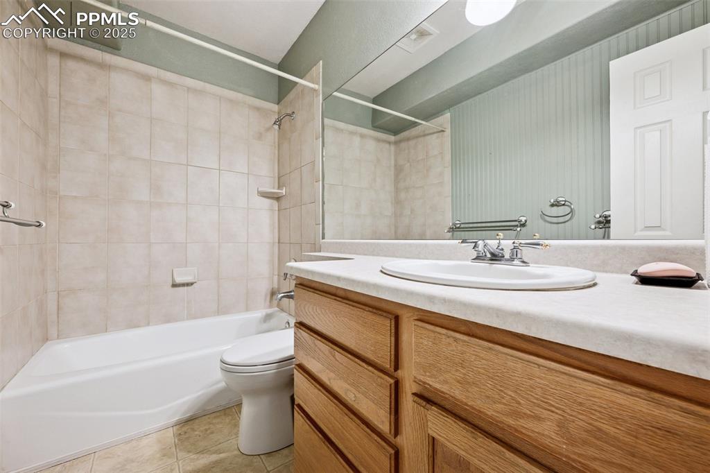 17522 Abert Ridge View Colorado Springs, CO 80908 - Photo 43 of 46 a bathroom with a sink and a mirror