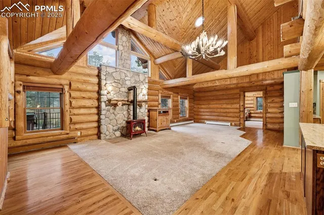 a view of a house with a barbeque and wooden stairs