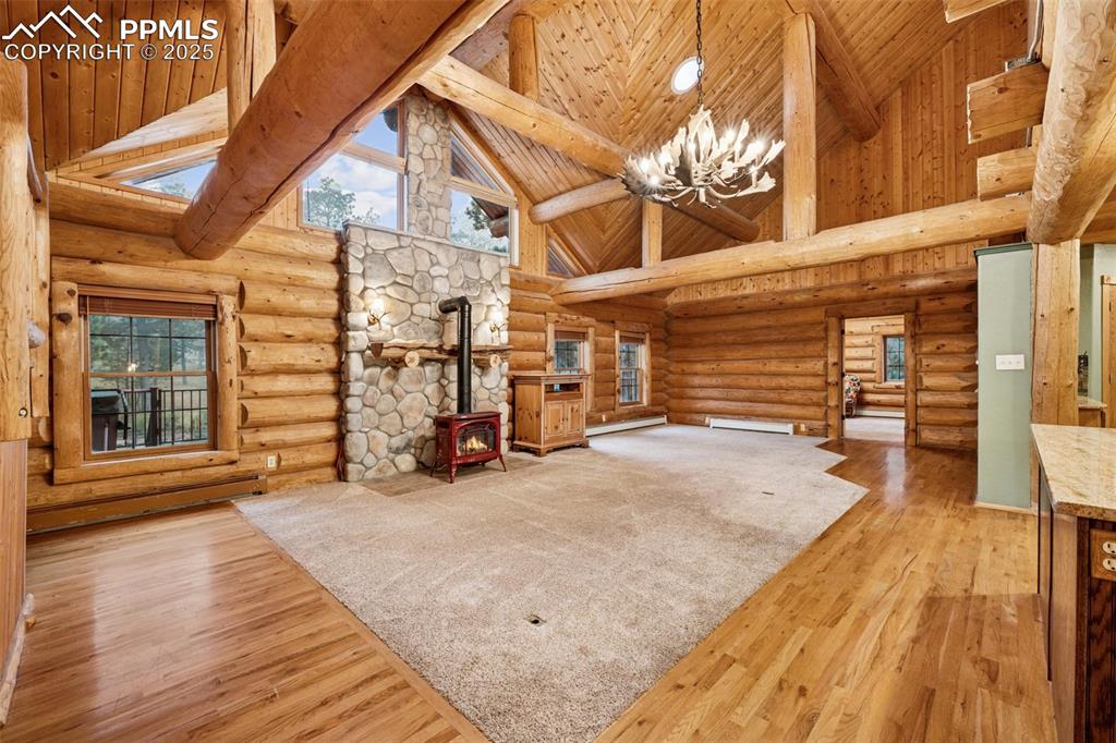 17522 Abert Ridge View Colorado Springs, CO 80908 - Photo 8 of 46 a view of a house with a barbeque and wooden stairs
