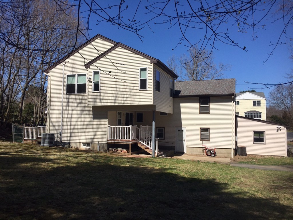 28 Lillian Road Lexington, MA 02420 - Photo 9 of 10 a front view of a house with a yard