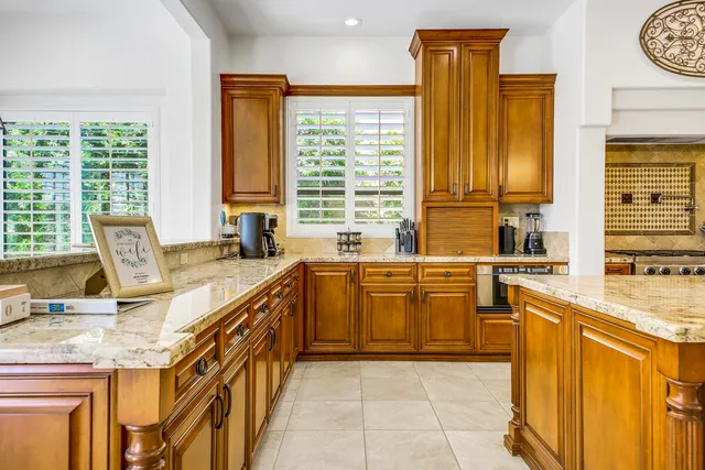 a living room with furniture ceiling fan and a rug