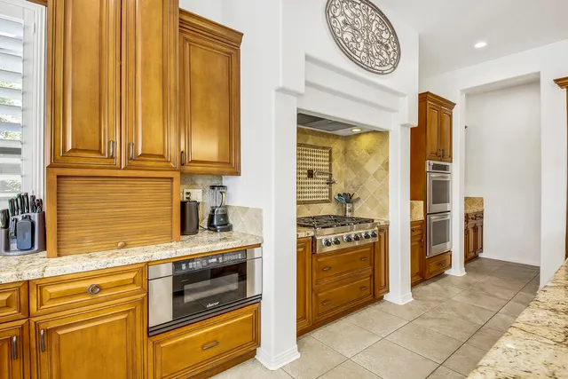 a bedroom with bed and wooden floor