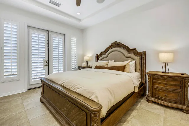 a bed room with a bed and a window