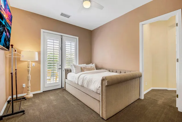 a view of a house with backyard and a patio