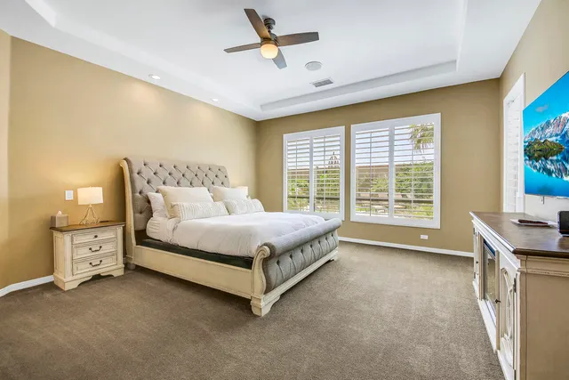a house with potted plants in front of it
