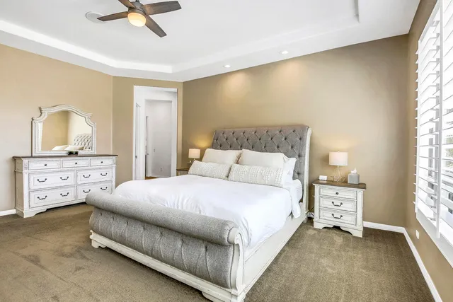 an aerial view of residential houses with outdoor space and parking