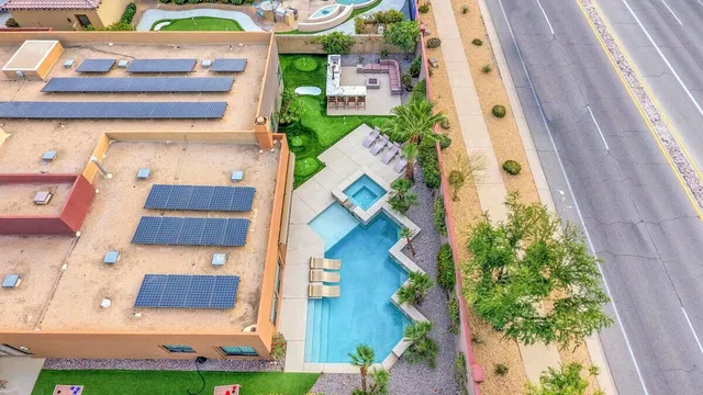 a bathroom with a granite countertop sink mirror and shower