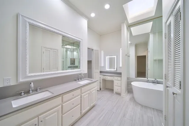 a bathroom with a double vanity sink a mirror and a