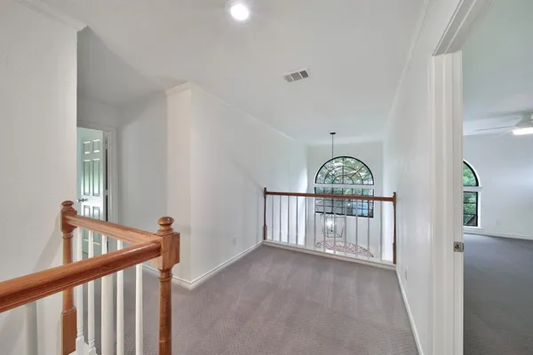 a view of a pathway of a house with a yard