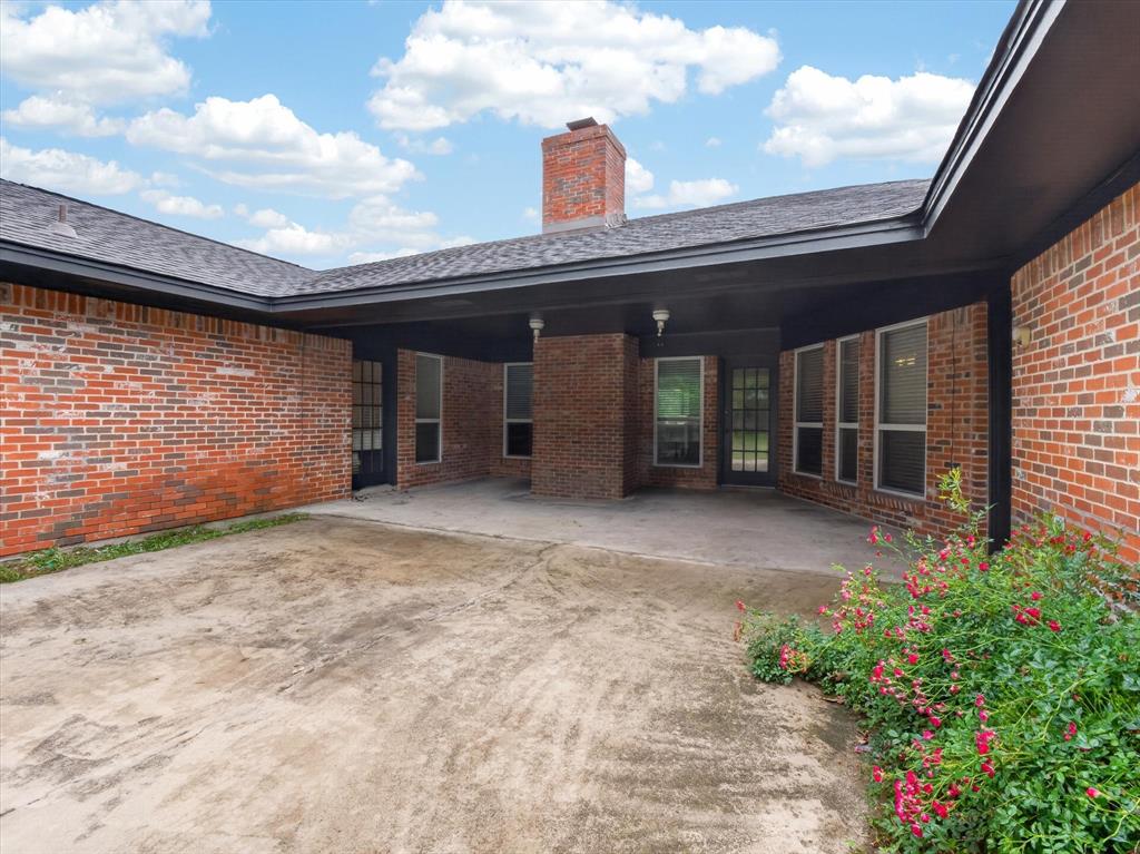 3209 Broken Arrow Road Denton, TX 76209 - Photo 32 of 39 Access to patio from owners suite and livingroom