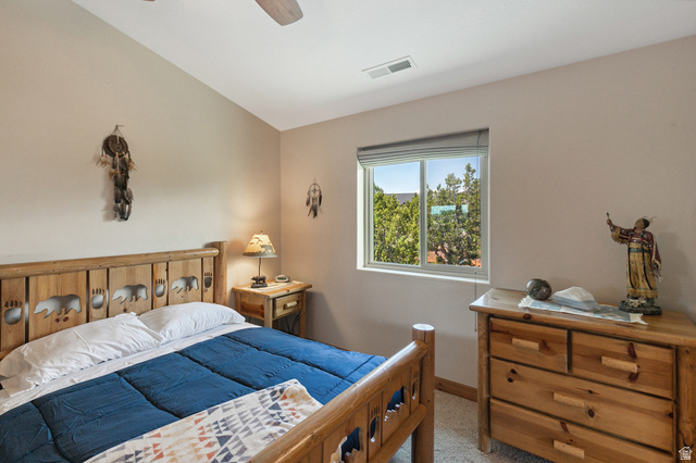 755 South Zion Ridge Drive Orderville, UT 84758 - Photo 59 of 84 Bedroom with lofted ceiling, ceiling fan, and light carpet