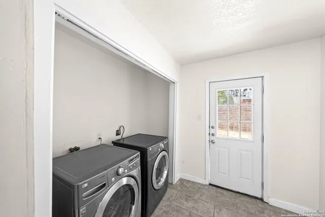 a utility room with dryer and washer