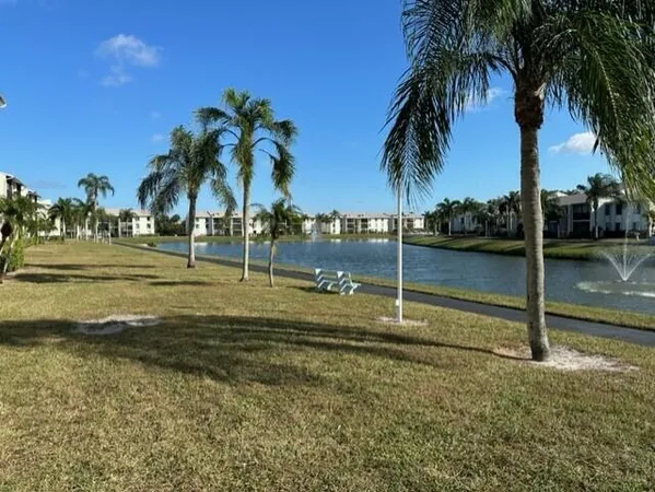 a view of a yard and swimming pool
