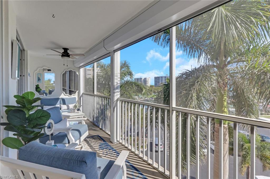 3 Bluebill Avenue, Unit 512 Naples, FL 34108 - Photo 4 of 25 Screened lanai overlooking the marina