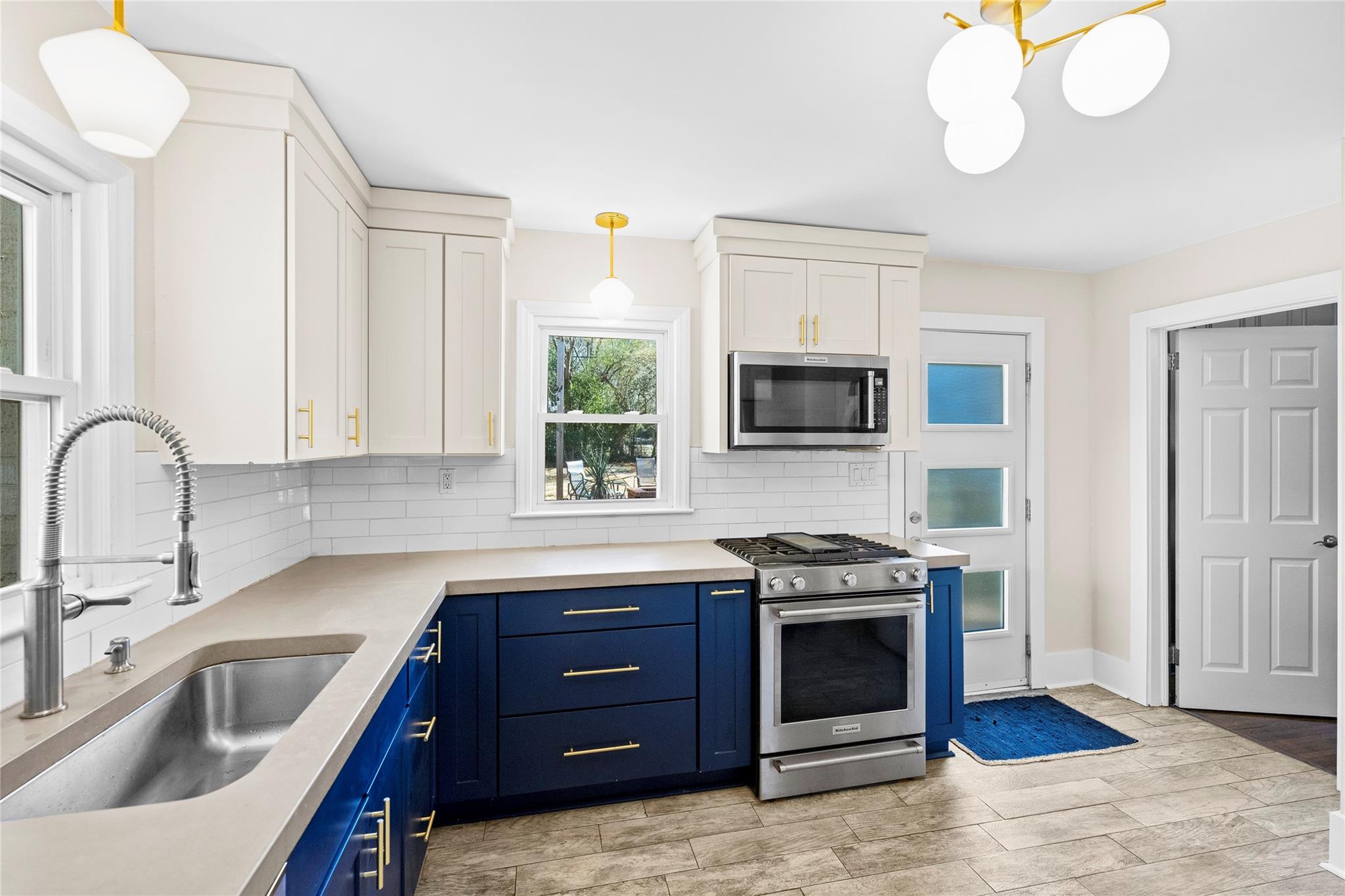 1114 Norland Road Charlotte, NC 28205 - Photo 16 of 36 a kitchen with stainless steel appliances granite countertop a sink and a stove