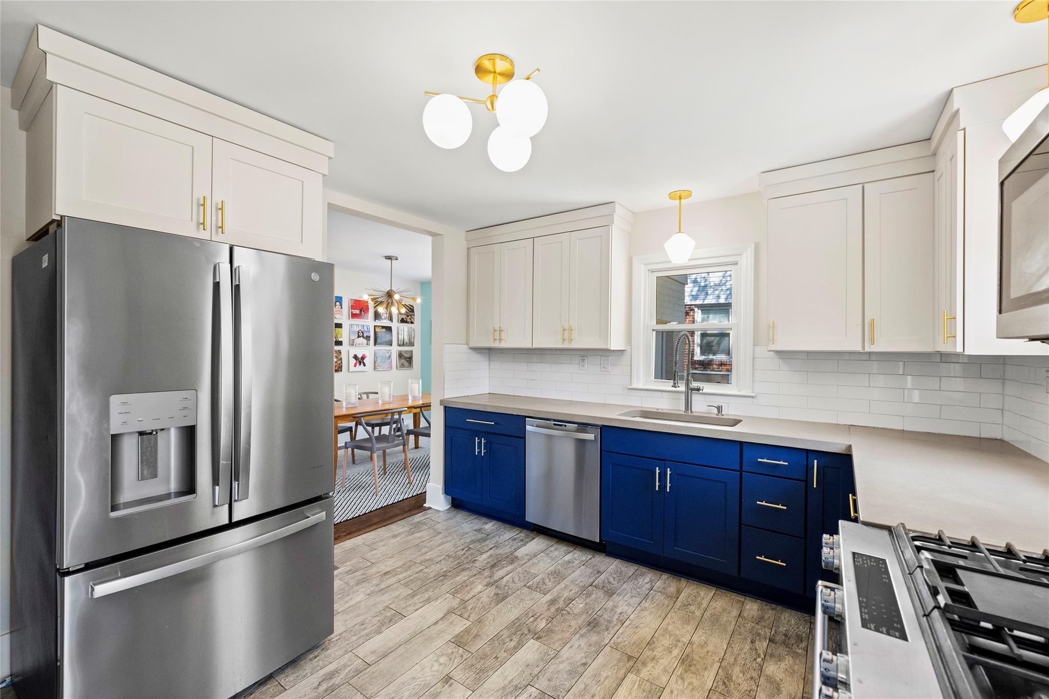 1114 Norland Road Charlotte, NC 28205 - Photo 17 of 36 a kitchen with stainless steel appliances granite countertop a refrigerator and a sink