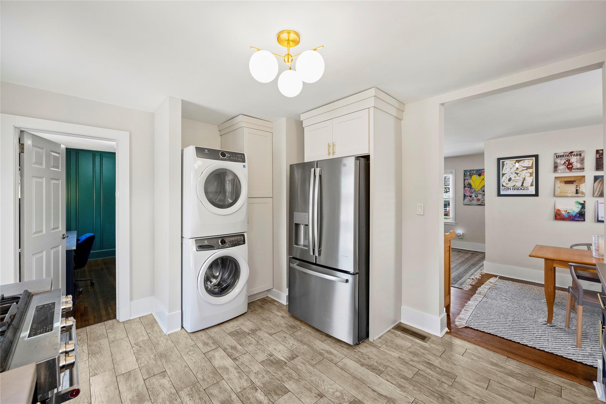 1114 Norland Road Charlotte, NC 28205 - Photo 19 of 36 a view of a kitchen with fridge and wooden floor