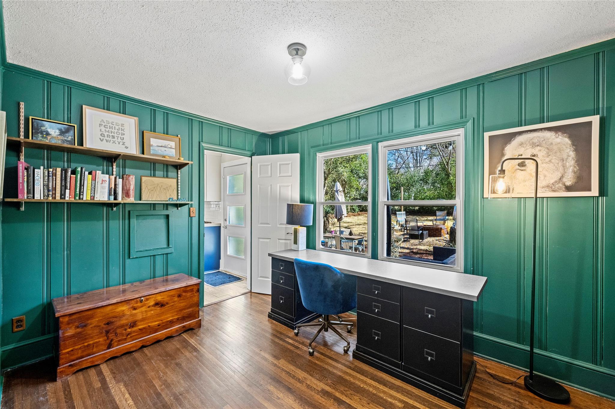 1114 Norland Road Charlotte, NC 28205 - Photo 20 of 36 a room with lots of wooden furniture and a book shelf