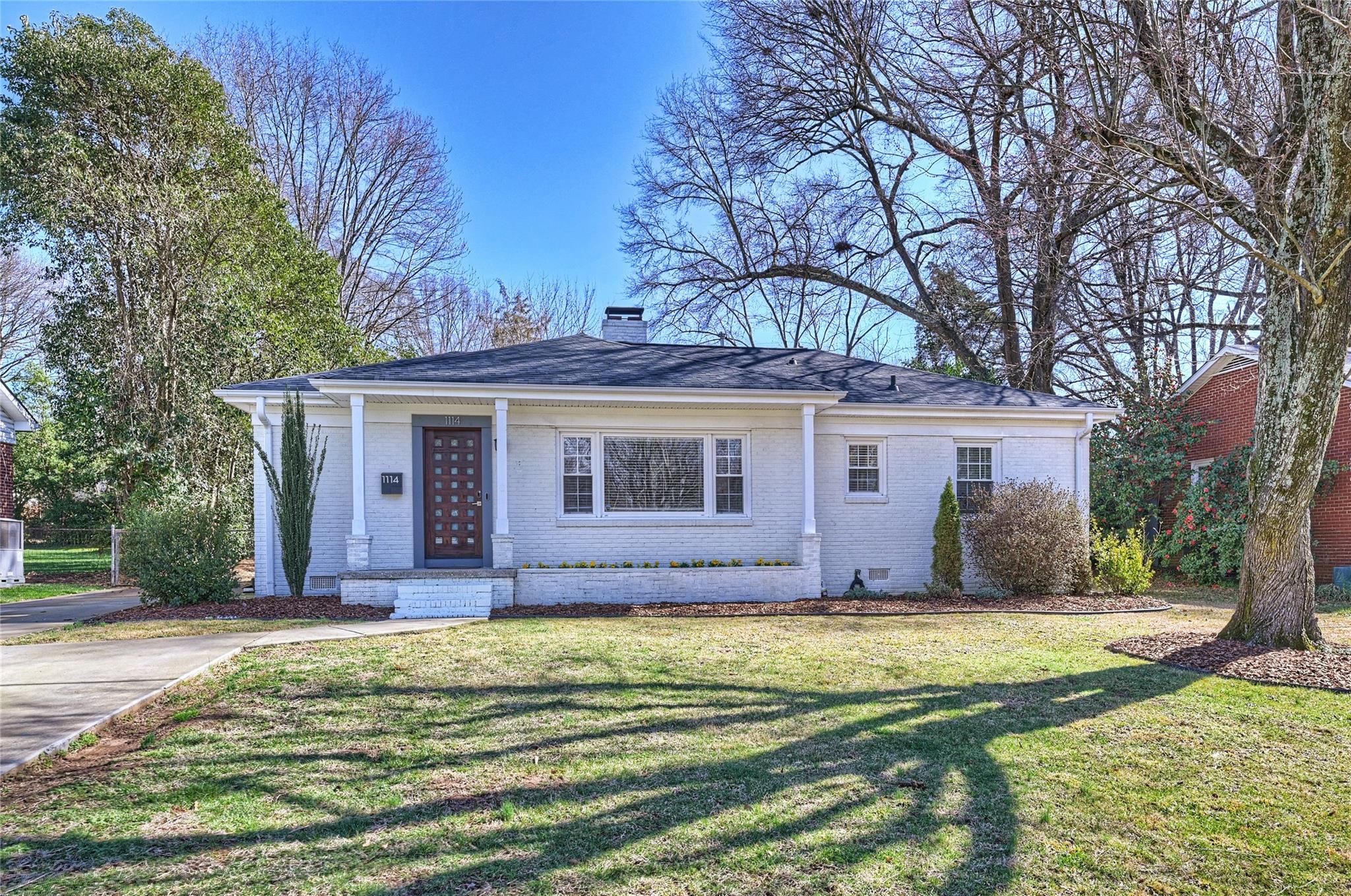1114 Norland Road Charlotte, NC 28205 - Photo 2 of 36 a view of a house with a big yard and large tree