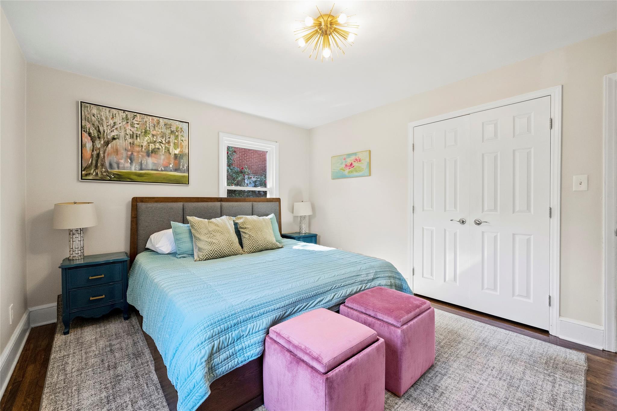 1114 Norland Road Charlotte, NC 28205 - Photo 22 of 36 a bedroom with a bed and a chandelier