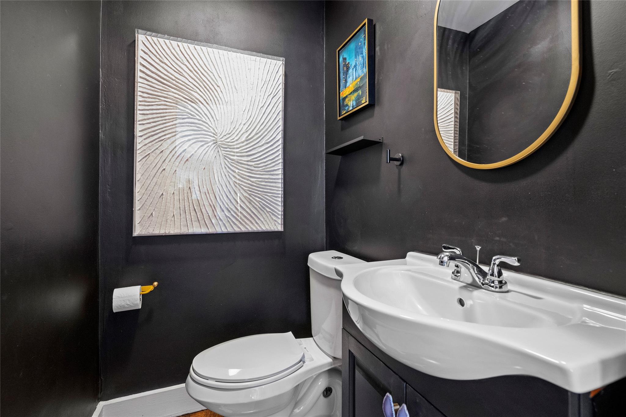 1114 Norland Road Charlotte, NC 28205 - Photo 26 of 36 a bathroom with a toilet a sink and a mirror