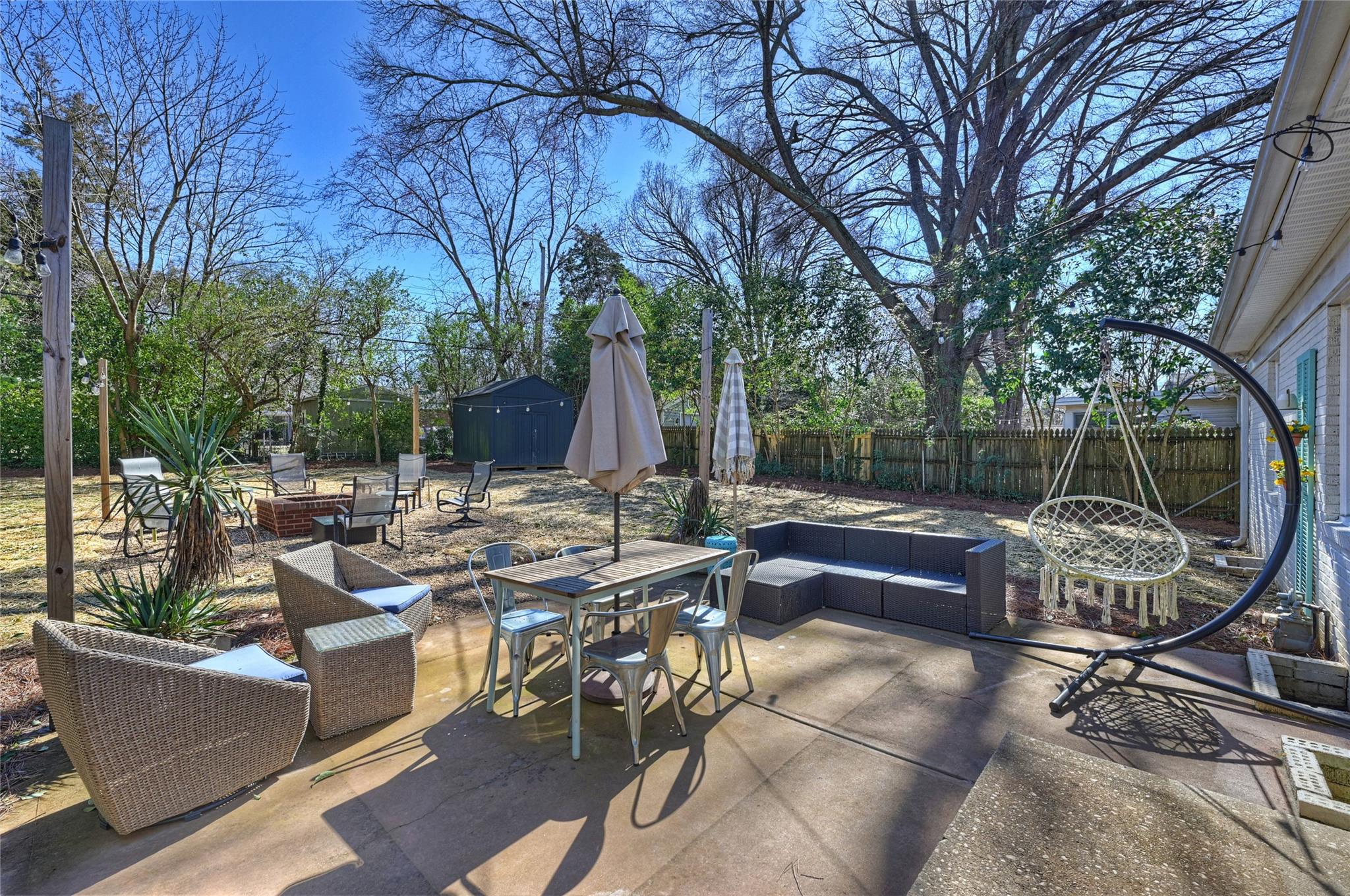 1114 Norland Road Charlotte, NC 28205 - Photo 27 of 36 a view of backyard with swimming pool and outdoor seating