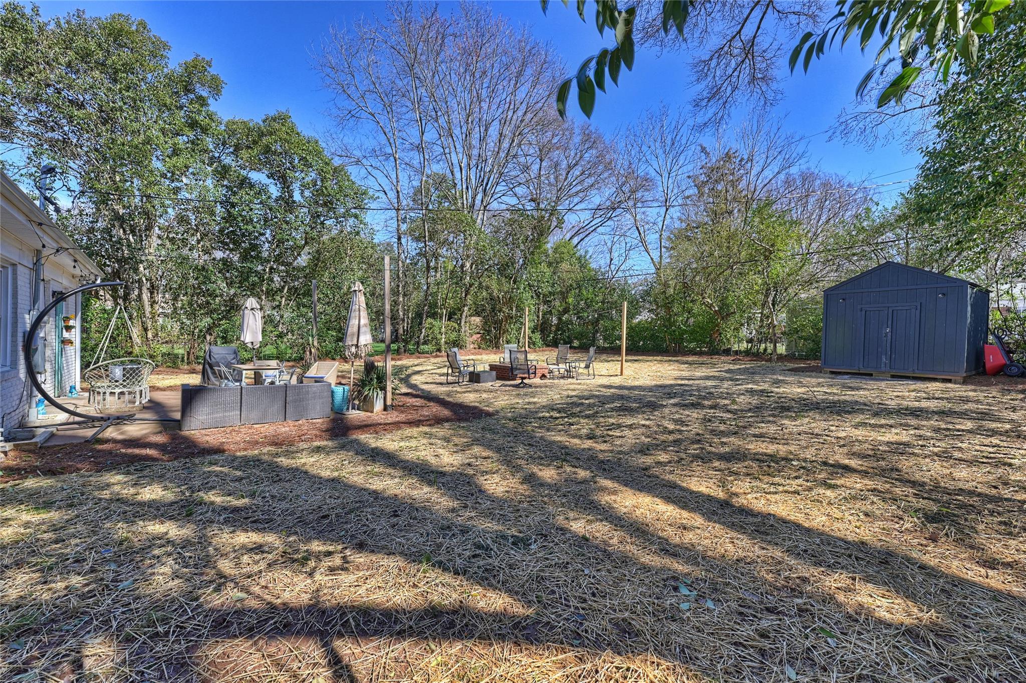 1114 Norland Road Charlotte, NC 28205 - Photo 29 of 36 a view of a backyard with large trees