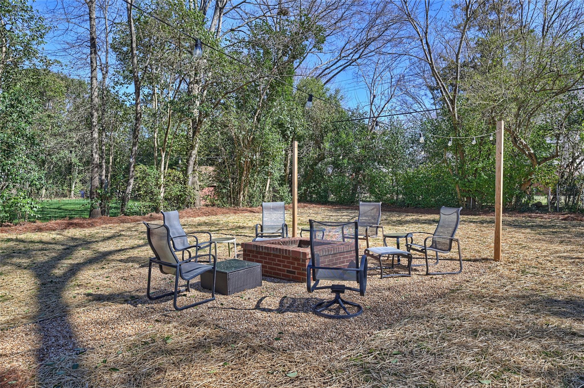 1114 Norland Road Charlotte, NC 28205 - Photo 30 of 36 a view of a chairs and table in backyard