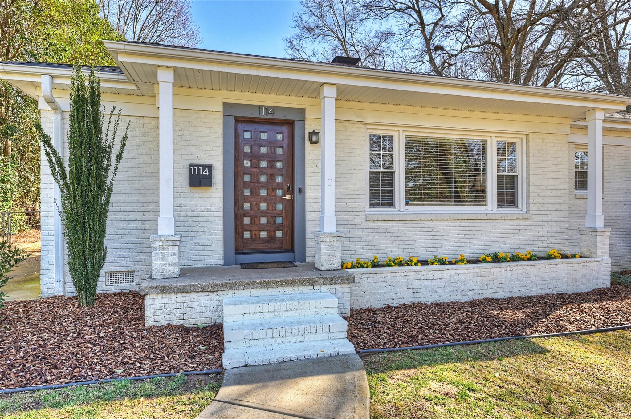 1114 Norland Road Charlotte, NC 28205 - Photo 3 of 36 a front view of a house with a yard