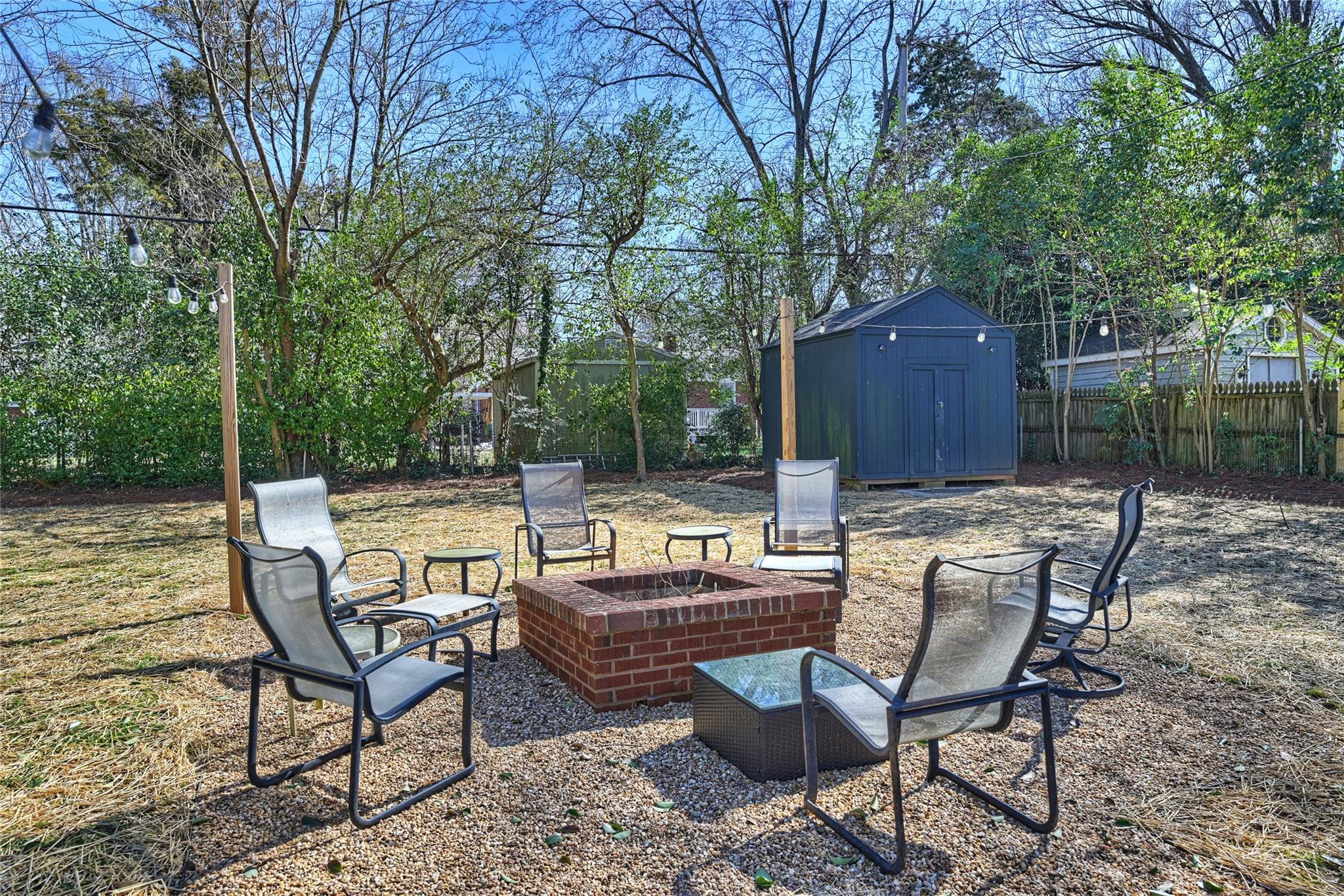 1114 Norland Road Charlotte, NC 28205 - Photo 31 of 36 a view of backyard with seating space and trees