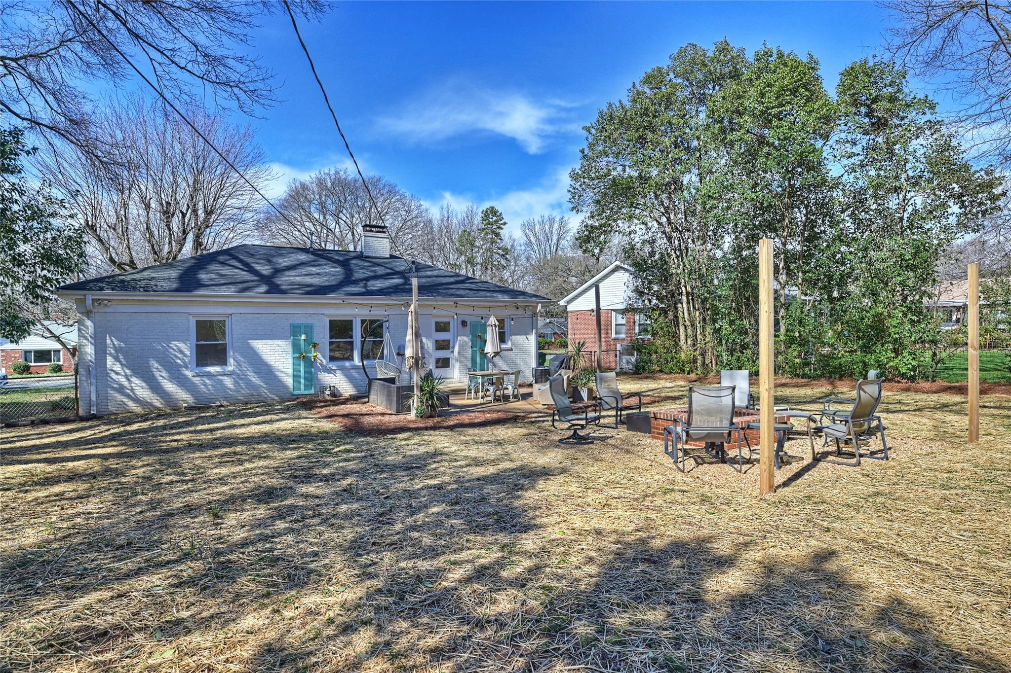 1114 Norland Road Charlotte, NC 28205 - Photo 34 of 36 a view of a house with backyard porch and sitting area