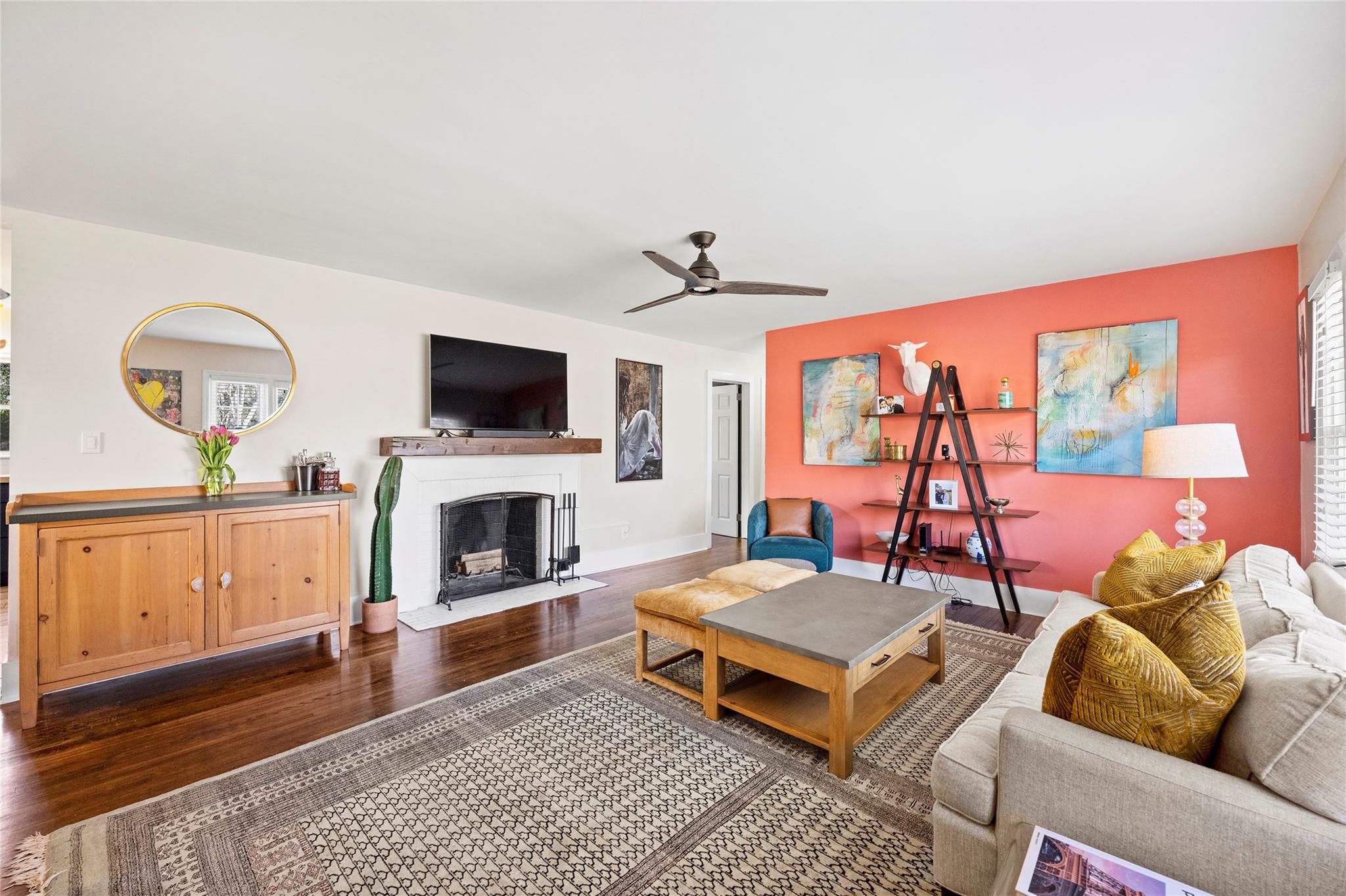 1114 Norland Road Charlotte, NC 28205 - Photo 5 of 36 a living room with furniture a fireplace and a flat screen tv