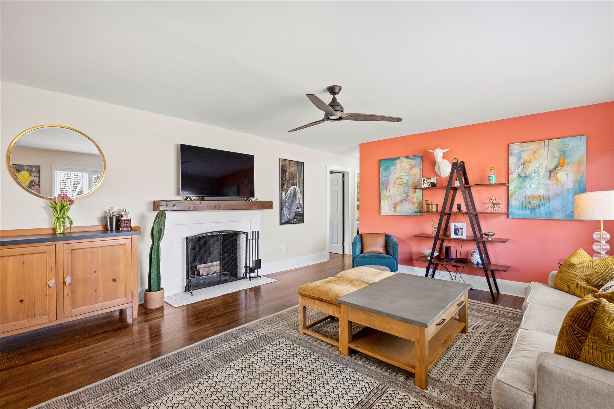 1114 Norland Road Charlotte, NC 28205 - Photo 6 of 36 a living room with furniture a fireplace and a flat screen tv