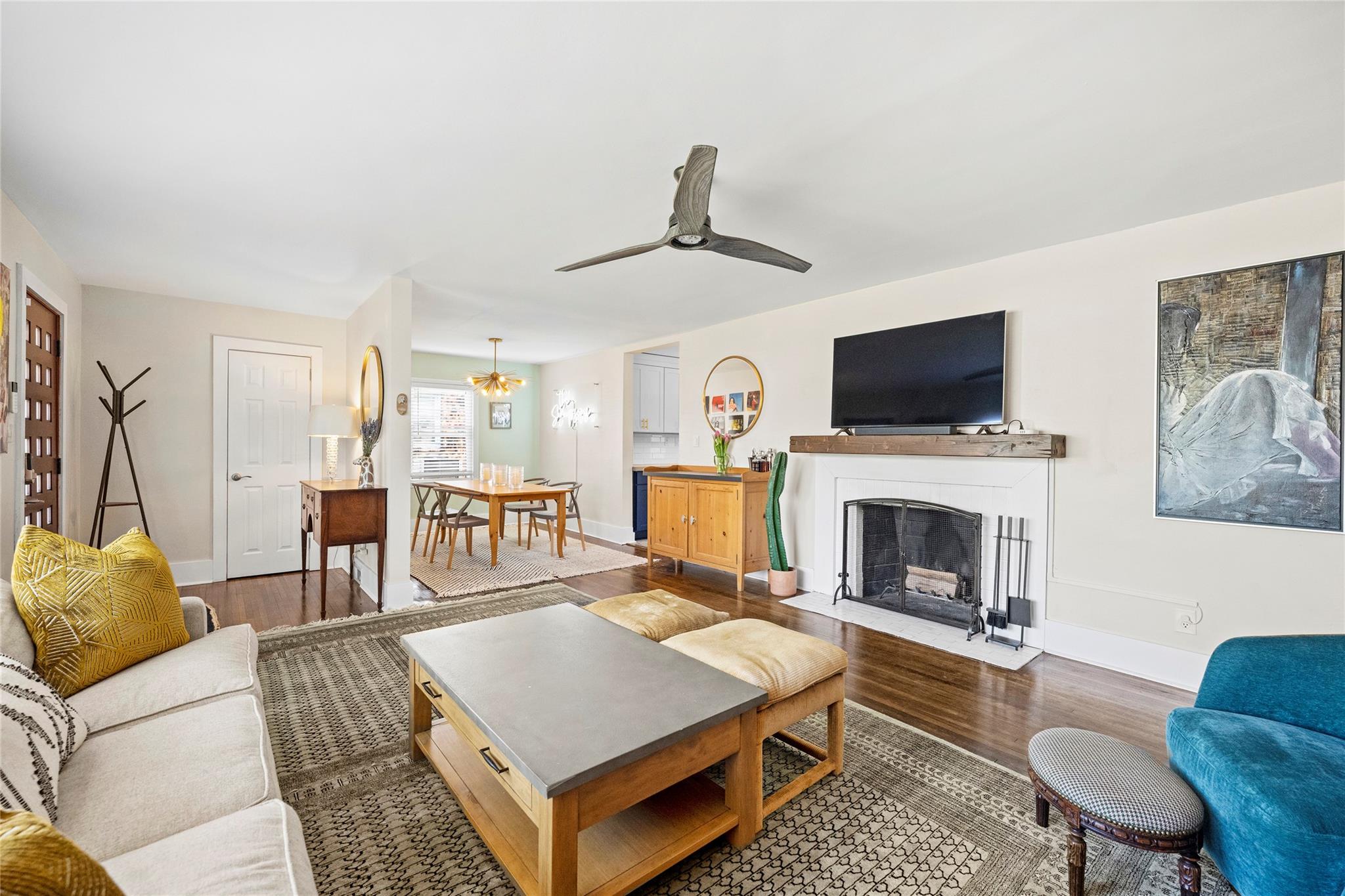 1114 Norland Road Charlotte, NC 28205 - Photo 7 of 36 a living room with furniture a fireplace and a flat screen tv