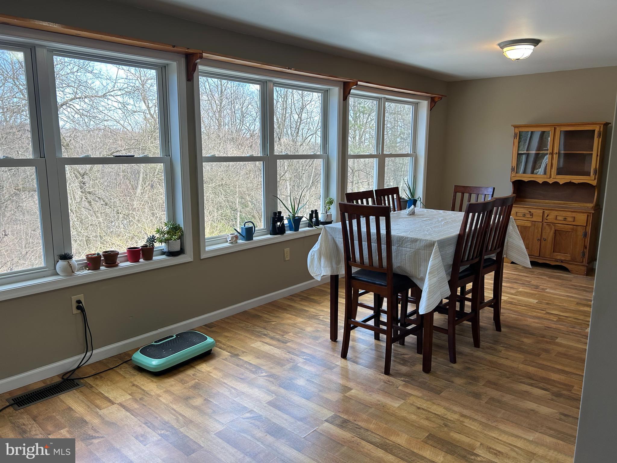 728 Mountain Road Boyertown, PA 19512 - Photo 11 of 26 a view of a dining room with furniture window and wooden floor