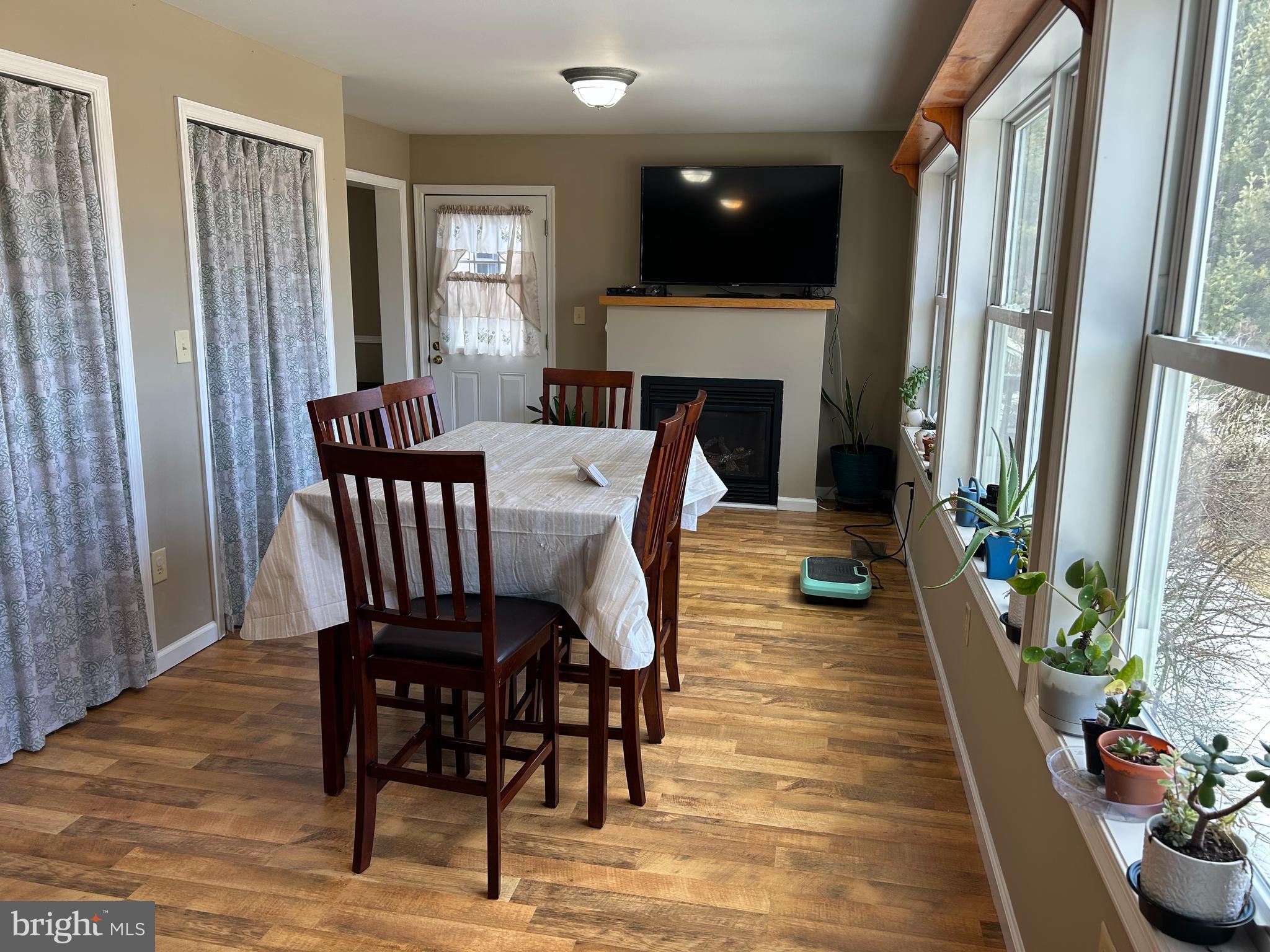 728 Mountain Road Boyertown, PA 19512 - Photo 12 of 26 a view of a dining room with furniture and a fire place