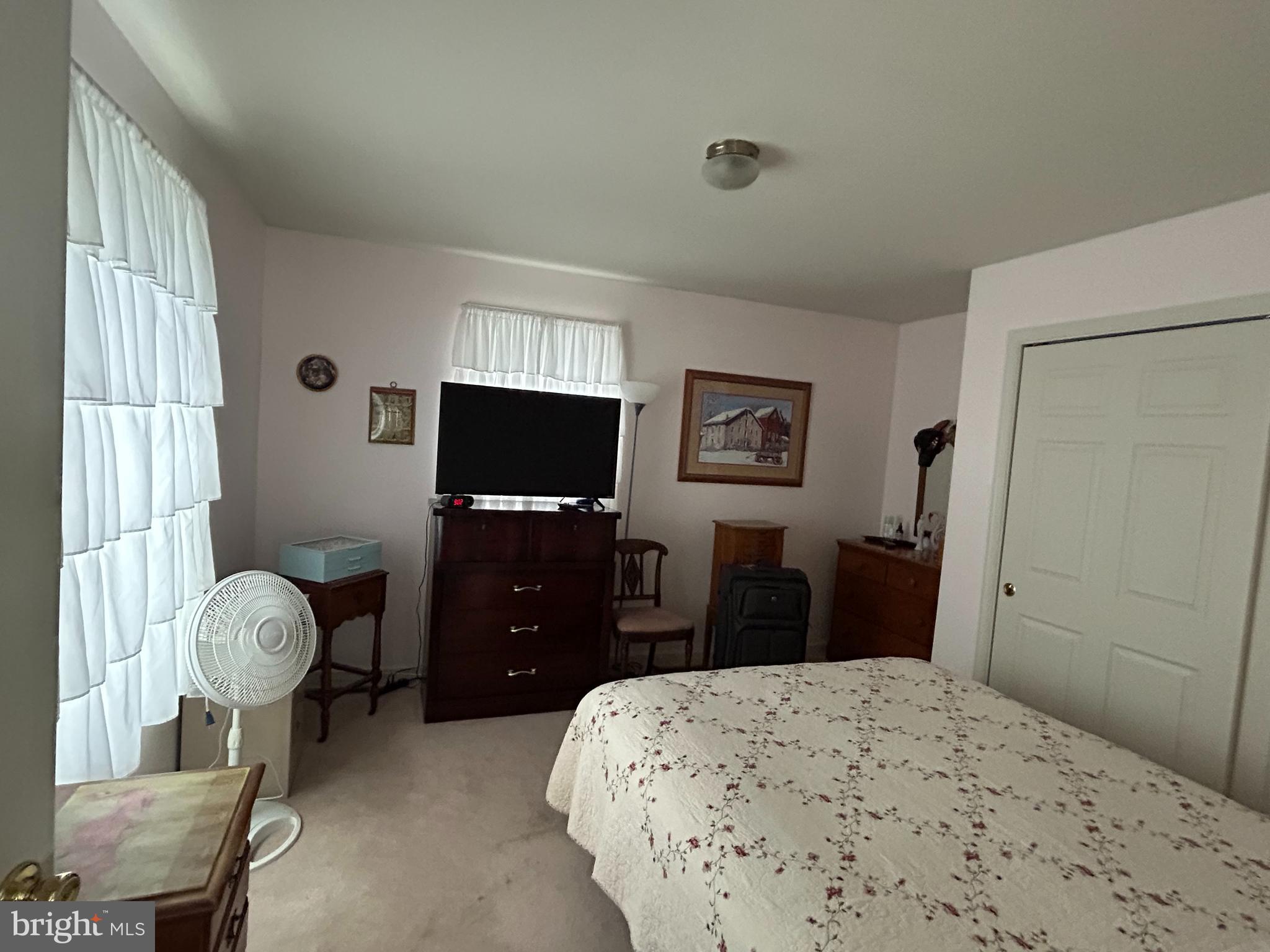 728 Mountain Road Boyertown, PA 19512 - Photo 18 of 26 a bedroom with a bed and a flat screen tv