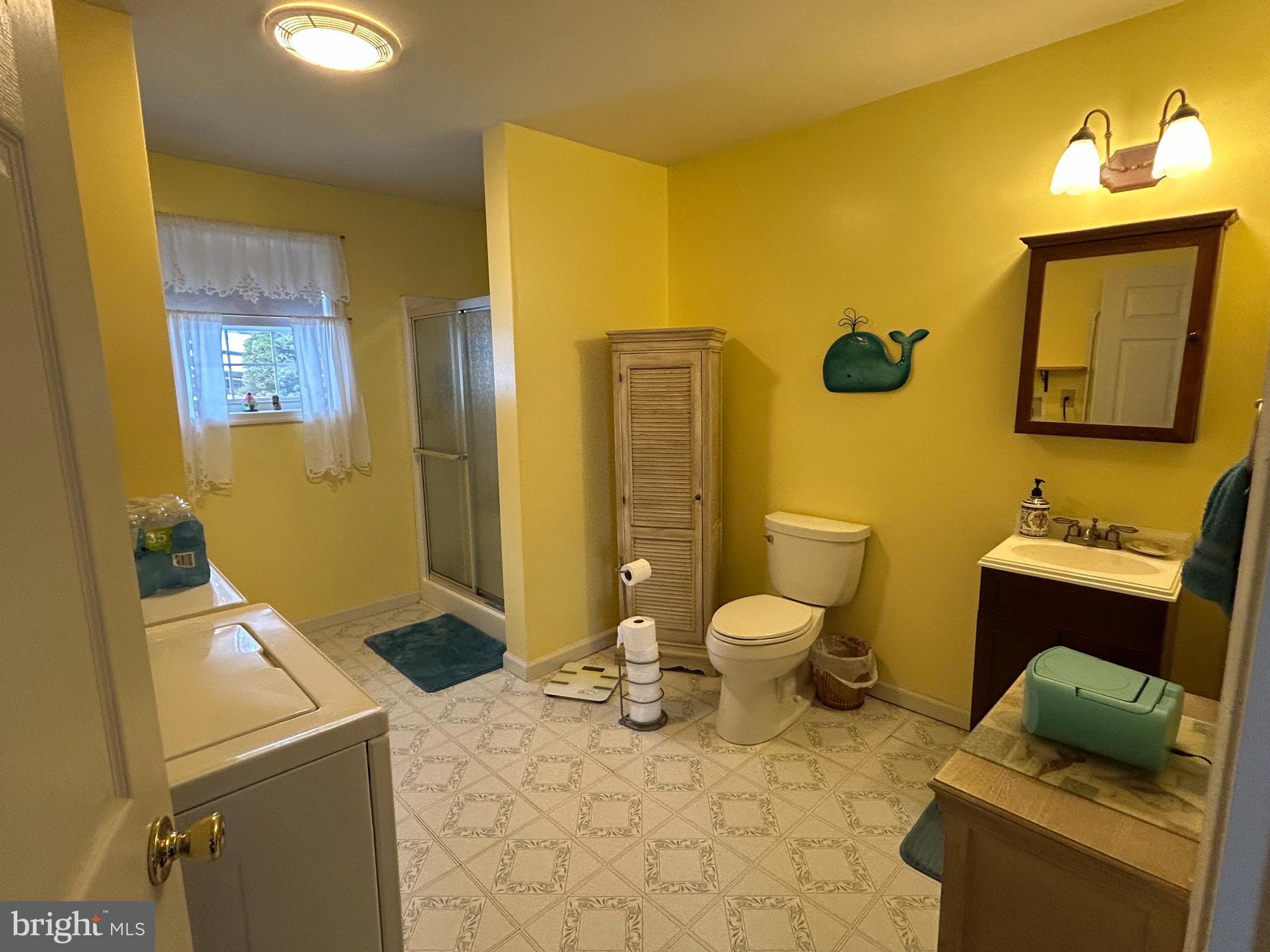 728 Mountain Road Boyertown, PA 19512 - Photo 20 of 26 a bathroom with a toilet sink and mirror