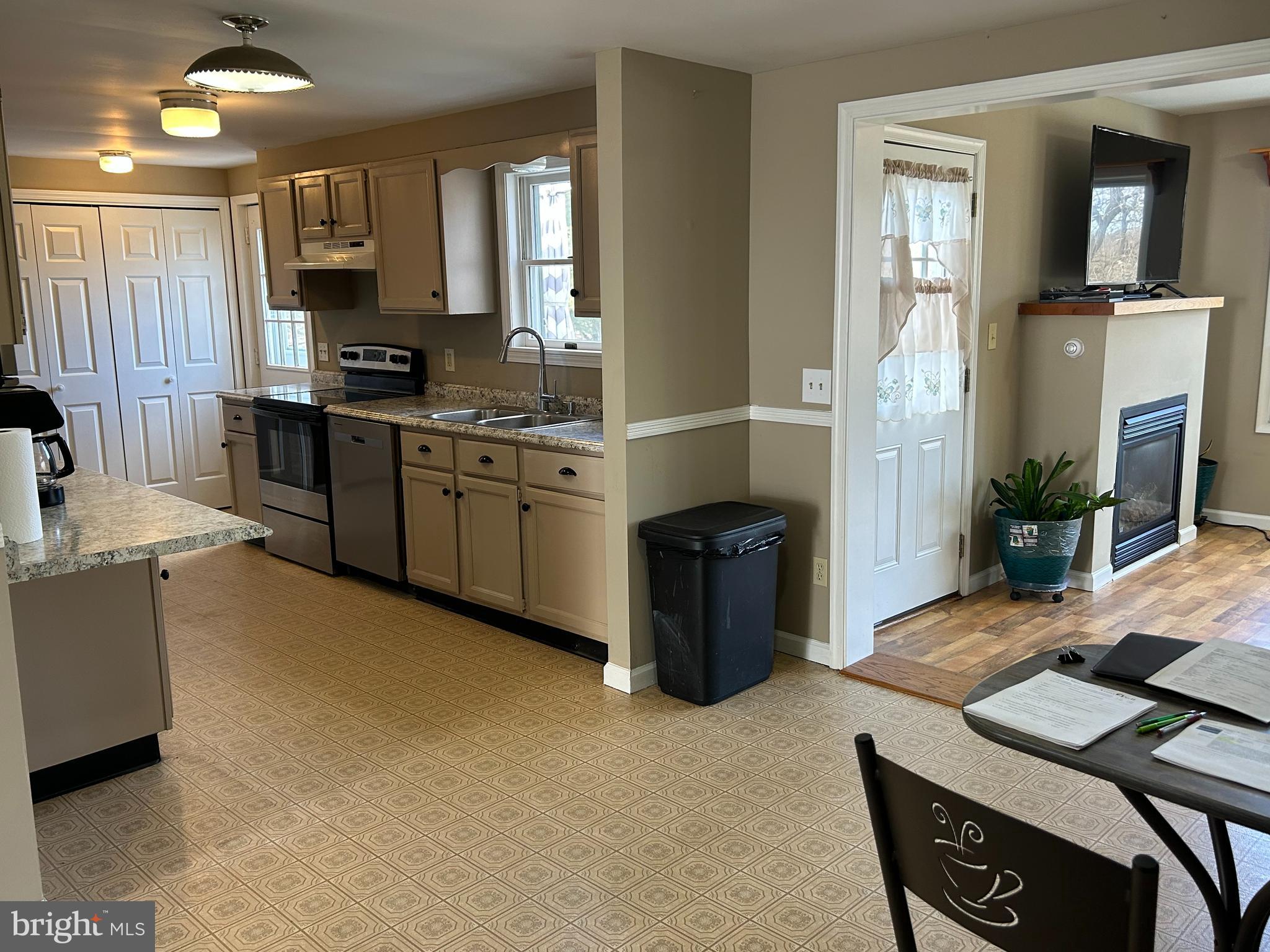 728 Mountain Road Boyertown, PA 19512 - Photo 9 of 26 a kitchen with stainless steel appliances granite countertop a stove a sink and a refrigerator