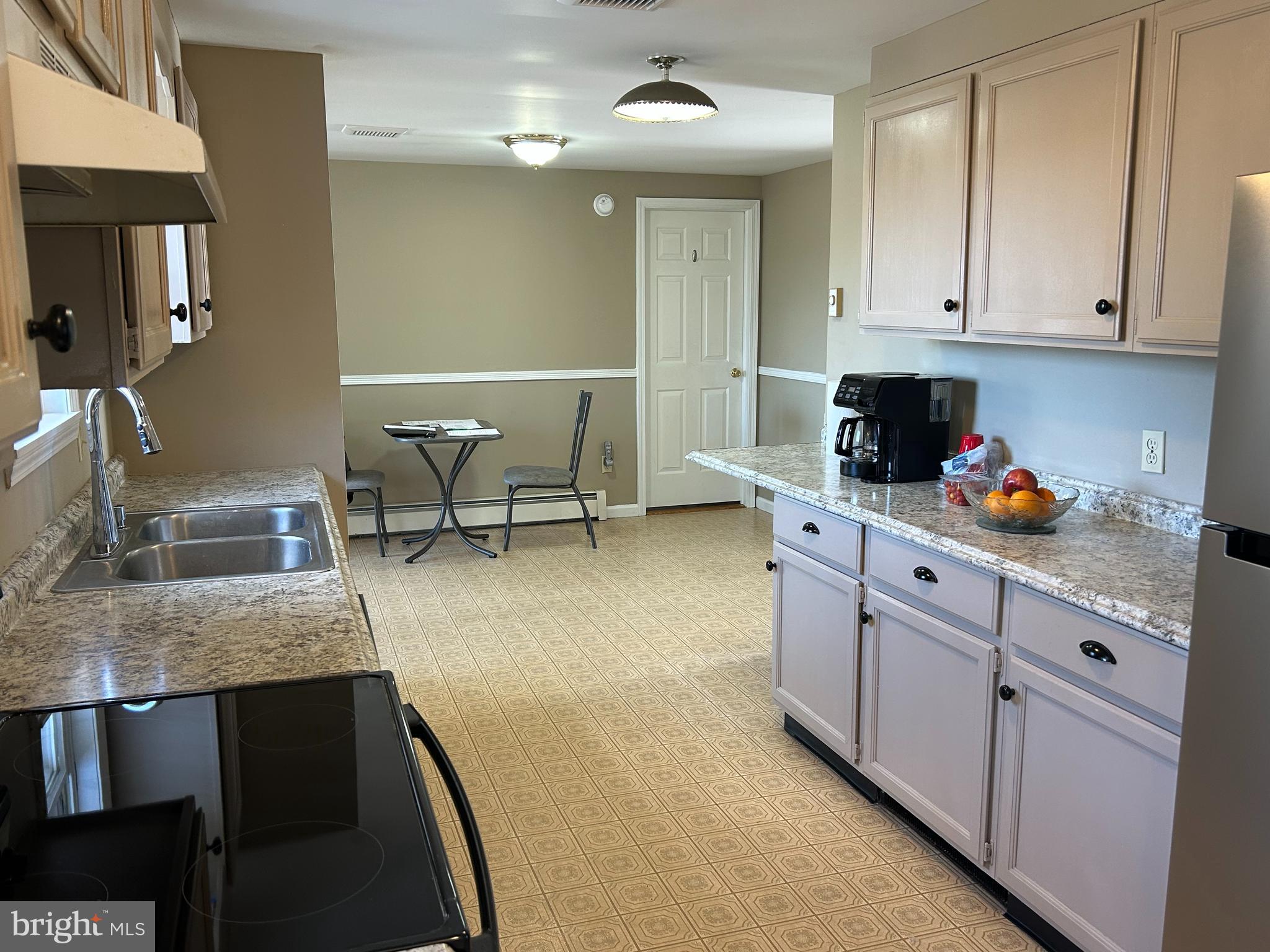 728 Mountain Road Boyertown, PA 19512 - Photo 10 of 26 a kitchen with cabinets and chairs