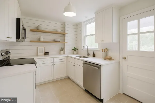 a kitchen with sink cabinets and window