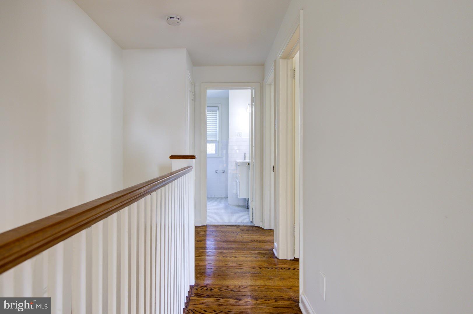 273 South Devon Avenue Wayne, PA 19087 - Photo 16 of 32 a view of a hallway with wooden floor and staircase