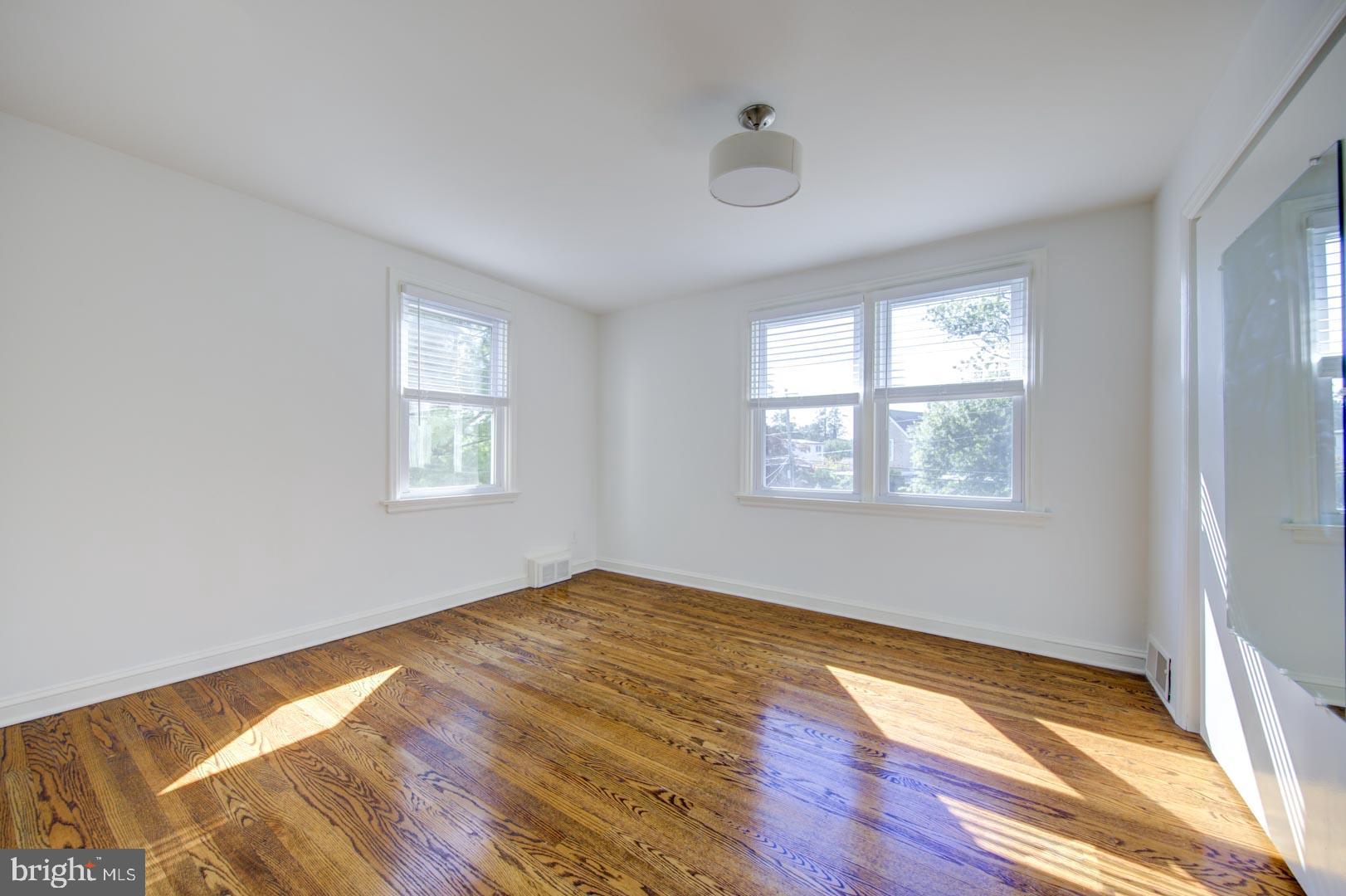 273 South Devon Avenue Wayne, PA 19087 - Photo 21 of 32 a view of empty room with wooden floor and fan