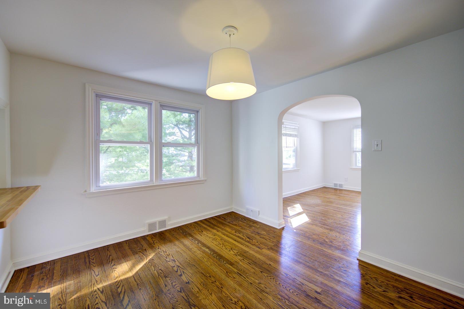 273 South Devon Avenue Wayne, PA 19087 - Photo 8 of 32 a view of an empty room with wooden floor and a window