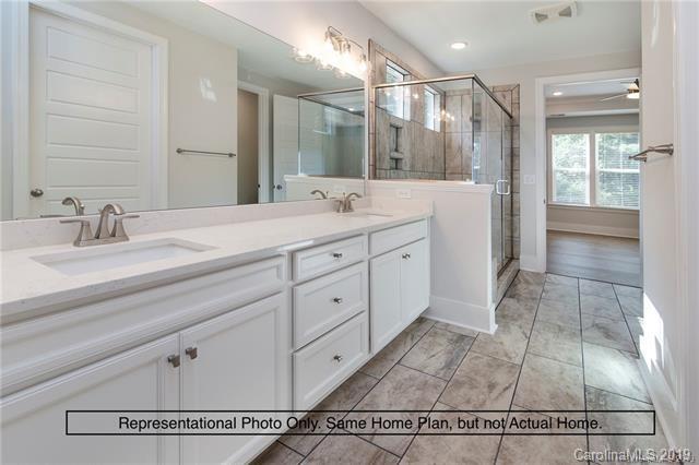 5345 State Rd S-46-557 Clover, SC 29710 - Photo 2 of 5 a spacious bathroom with a sink a mirror and a shower