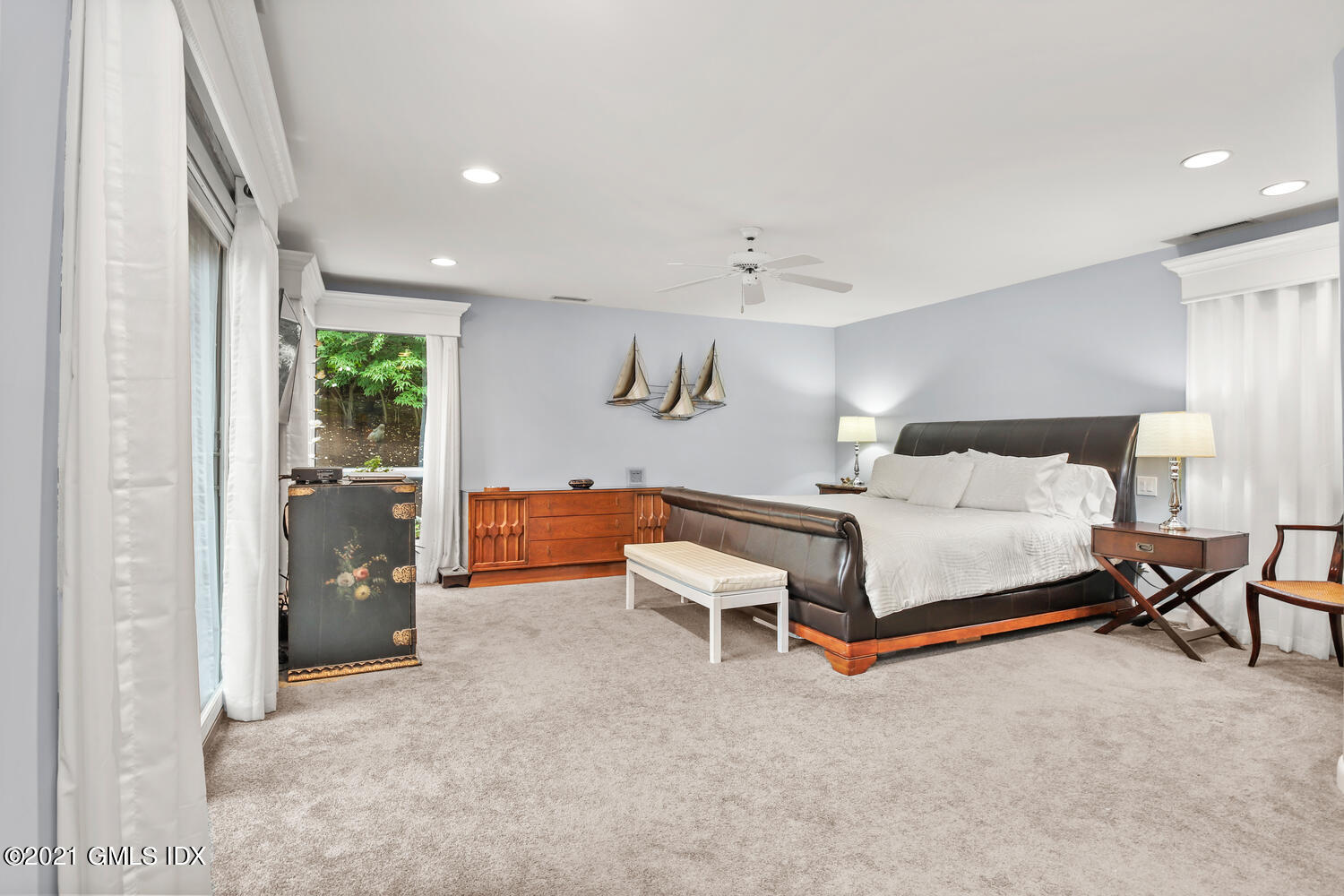 53 Dagmar Road Stamford, CT 06905 - Photo 13 of 36 a bedroom with a bed and a cabinets