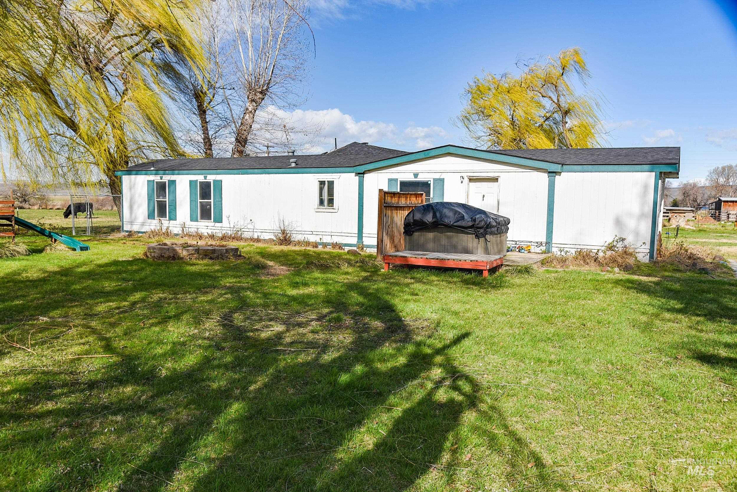 Undisclosed Address Boardman, OR 97818 - Photo 6 of 13 Back of house featuring a yard