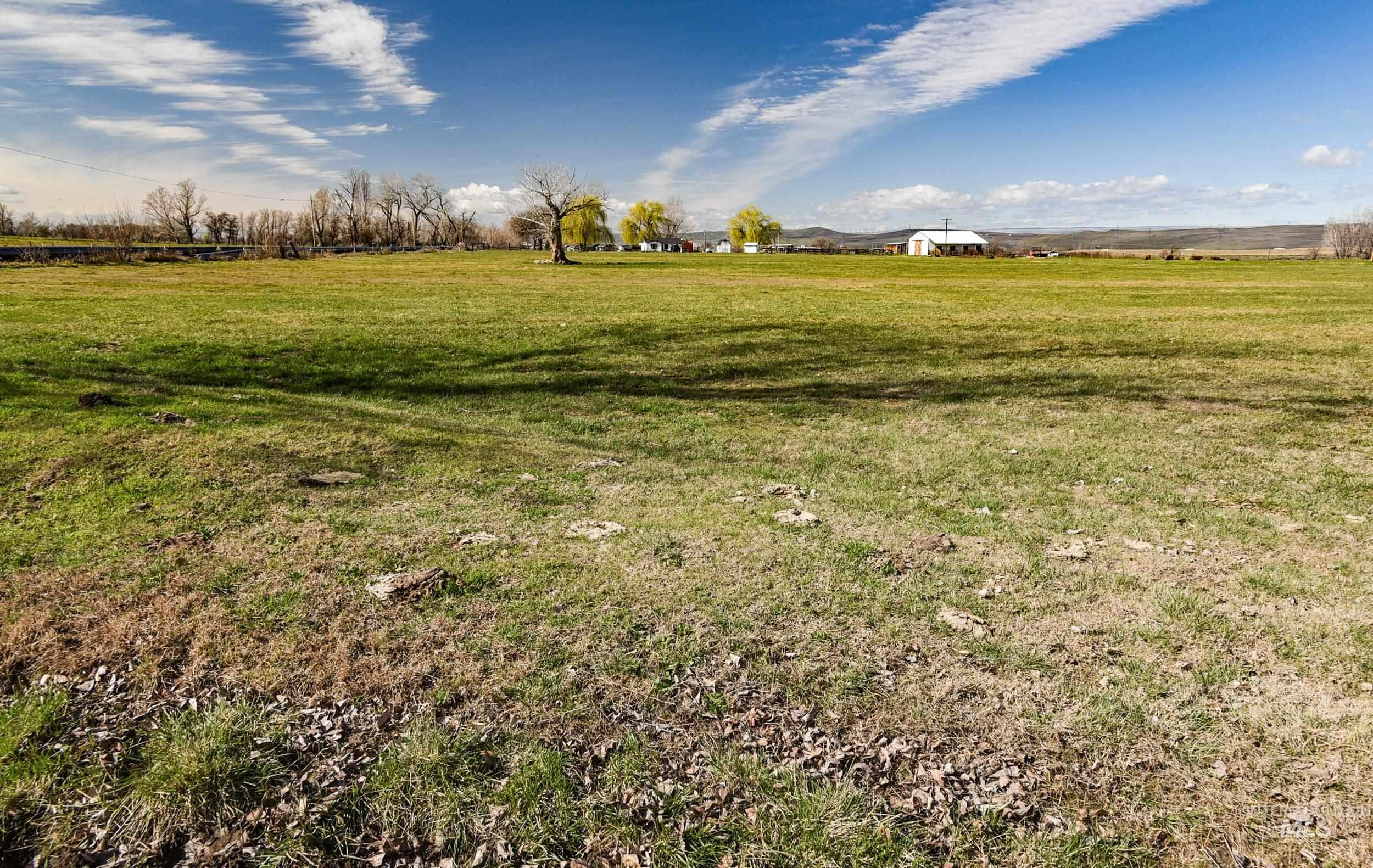Undisclosed Address Boardman, OR 97818 - Photo 10 of 13 View of green lawn featuring a view of countryside