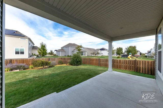 a view of a house with backyard porch and garden